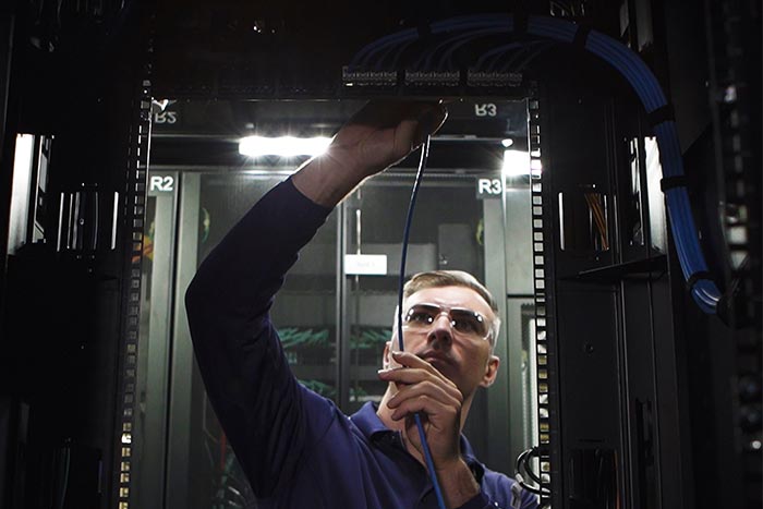 Remote hands technician in data centre